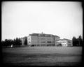 Grounds and building, Arleta School, Portland. Large field in foreground.