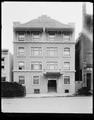 Leeds Apartment building, Market St., Portland. Front view of building, cord wood stacked on sidewalk.