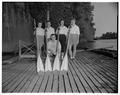 The women's intramural crew team from Winston House posing next to the Willamette River