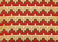 Textile panel of woven red, dark olive, and shades of beige wool and linen in a squared linear pattern