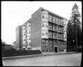 Dezendorf Apartments on 16th St., Portland. Vacant lots on both sides of building.