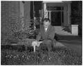 Don Martel, Head of Landscape Architecture, placed identification tags on shrubs on campus, March 1958