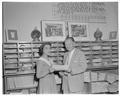 Dean George Crossen presenting outstanding pharmacy student award for 1958, June 1958