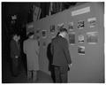 Examining a display at the Forestry Centennial Conference and Fernhopper's Banquet