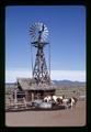 Horses by windmill at Harrison ranch, near Fort Rock, Lake County, Oregon, circa 1972