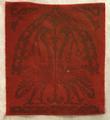 Textile panel of deep red velvet with a darker red print of an ornamental design