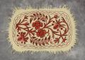 Numdah Rug of off-white unspun felted wool with red and salmon pink chain stitch floral embroidery with black outline