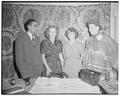 Foreign students looking over exhibits at Cosmopolitan Club meeting, September 30, 1950