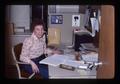 Cleora Adams sitting at desk, Corvallis, Oregon, January 1976