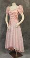 Dress of pink satin and floral lace