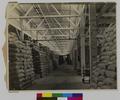 Interior of warehouse at dock, Astoria. Sacks of grain. (recto)