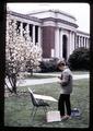 Artist painting Memorial Union and magnolia, Oregon State University, Corvallis, Oregon, circa 1970