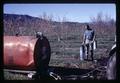 Superintendent Porter Lombard with a gas burner, Southern Oregon Experiment Station, Medford, Oregon, February 1970