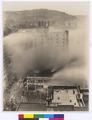 Northwestern School Fire being put out. Viewed from above. Vista ('Suicide') Bridge in background (recto)