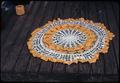 29 inch wide crocheted orange and white doily unfinished