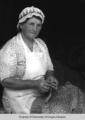 S.U. Wyatt, weaver, dyer, spinner: woman with woven work in lap
