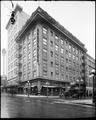 Exterior of Cornelius Hotel, from corner Alder and Park, Portland. Woodard Clarke drugstore in background, shoe store on corner.