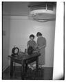 Home Economics students using a sanding machine, January 1954