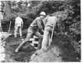 Men working on concrete cribbing at undisclosed Visitor Center