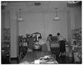 Clothing and textile workshop students working with machinery during summer school, July 1954