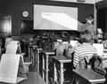 Typing students viewing projector screen