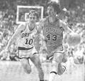 Guard Brian Hilliard drives past U of O's Mike Drummond