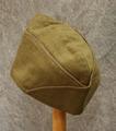 Army infantry uniform cap of olive drab wool with trim of navy and gold braided pipe