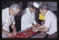 Bob Cain and Bob Foote at strawberry sorting table, Oregon State University, Corvallis, Oregon, 1973