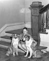 Jean Tibbets with dogs on courthouse steps