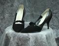 Pumps of black leather with black suede vamp and heel