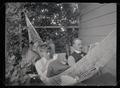 H. T. Bohlman and W. L. Finley reading on the porch