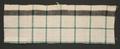 Textile panel (sample) of woven cotton plaid in off-white, black and green