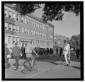 Passing time in front of Commerce Hall