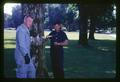 Bob Every observing aphid control injection system into tree at OSU, Corvallis, Oregon, 1967