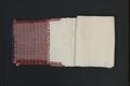 Loin Cloth "Bahag" of hand-woven white cotton with 6" band at each end in blue and red stripes with an overlapping white diamond diaper pattern