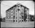 Nob Hill Apartments at 19th and Marshall, Portland. Houses in background, power pole in foreground.