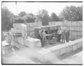 Joe Butts, W. Weniger, J. J. Brady, and R. R. Dempster at installation of new cyclotron, 1950