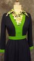 Dress of navy wool knit with bright green knit band trim and two separate snap-in dickies