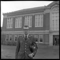 Clifford Dempster, a member of the OSU G.E. College Bowl team, posing near Kerr Library