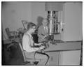 Dean Francois Gilfillan with new electron microscope installed by physics department, 1951
