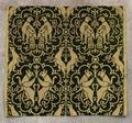 Textile panel of metallic gold threads with green voided velvet design