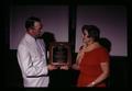 Anthol Riney presenting Alumni Award to Gloria Philippi Davis at 4-H Leaders Banquet, Gilliam County, Oregon, circa 1970