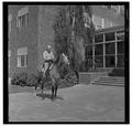 E. L. "Dad" Potter, Animal Husbandry professor, posing with a horse, May 1964