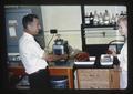 Dr. Clifford E. Samuels and technician testing strawberries, 1965