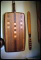 15 x 1 1/2 inch spatula for making lefse, made in early 1970s and 7 x 13 x 3/4 inch cheese board, made 1973