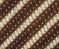 Textile Fragment of blue, brown and white cotton batik in a traditional design of diagonal repeating S and lines