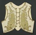 Vest of ecru felt with metallic gold embroidery couched in yellow threads and accented with turquoise cabochons