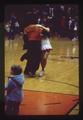 Benny Beaver and Rally Girl dancing at basketball game, Gill Coliseum, Corvallis, Oregon, February 1982