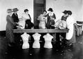 Community leaders in Clatsop County work with dress forms, 1923