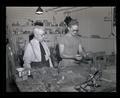 John Fulton with a student in the chemistry glass-blowing laboratory